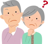 首をかしげる老夫婦